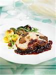 Roast pork stuffed with prunes and almonds,red onion chutney