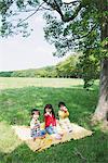 Children Eating Food in Park