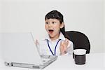 Excited Girl as Businesswoman with Laptop