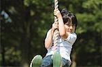 Girl Swinging On Rope