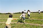 Children Playing In Paddy Field