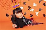 Girl in Costume for Halloween Holding Magic Wand