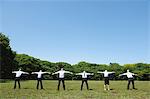 Businesspeople stretching in a Park