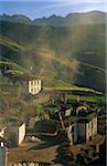 India, Himachal Pradesh, Spiti, Spiti Valley, Demul. Morning wood-smoke from domestic fires hangs above the village's homes.