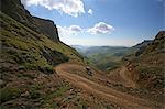 Lesotho, Sani Pass. The border with South Africa in the Drakensberg Mountain range. A 4x4 slowly makes it way down the steep incline.