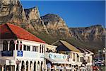 Restaurants on Victoria Road with Twelve Apostles in background, Camps Bay, Cape Town, Western Cape, South Africa