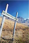 Signpost on hiking trail in Monk's Cowl Nature Reserve with Champagne Castle in background, Ukhahlamba-Drakensberg Park, KwaZulu-Natal, South Africa