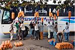 Orange-sellers offer their fruit to passengers on a coach travelling from Dar-es-Salaam to Nairobi.