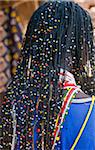 A Sukuma man with an elaborate hairstyle.  The Sukuma are the largest tribe in Tanzania.