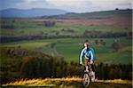 Gilar Farm, Snowdonia, North Wales.  Man mountain biking.