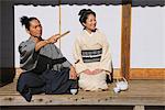 Samurai Couple Relaxing  On A Veranda