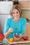 Woman eating Pomegranate