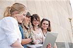 Young Women Using Laptop Computer