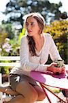 Woman Drinking Coffee at Cafe