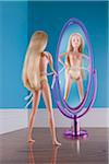 Doll Measuring Waist in front of Mirror