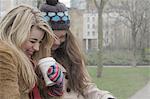 2 young women having a take away drink