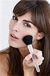 Woman applying foundation