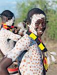 The Karo excel in body art. Before dances and ceremonial occasions, they decorate their faces and torsos elaborately using local white chalk, pulverised rock and other natural pigments.  Young men like their hair braided in striking styles.The Karo are a small tribe living in three main villages along the lower reaches of the Omo River in southwest Ethiopia.