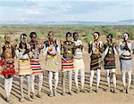 At the start of a dance, Karo men sing and clap in line.The Karo excel in body art. Before dances and ceremonial occasions, they decorate themselves elaborately using local white chalk, pulverised rock and other natural pigments.The Karo are a small tribe living in three main villages along the lower reaches of the Omo River in southwest Ethiopia.