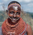 Samburu girls are given strings of beads by their fathers when they are still young. As soon as they are old enough to have lovers from the warrior age set, they regularly receive gifts from them.Over a period of years, their necklaces can smother them up to their necks.