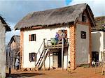 An attractive Malagasy home of the Betsileo people who live southwest of the capital, Antananarivo.Most houses built by the Betsileo are double storied with kitchens and living quarters located on the first floor.Livestock is often kept in the ground floor of a house overnight.