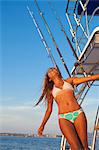 woman on ladder of yacht