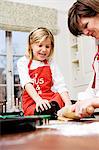 Mother and daughter baking.