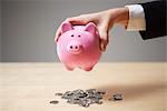 A man holding a piggy bank.