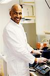 A smiling male researcher in a laboratory, Sweden.