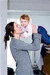 Mother lifting her daughter, Sweden.