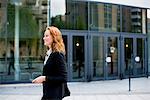 Woman with a cellphone and headset, Stockholm, Sweden.