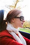 A young Scandinavian woman in a cabriolet, Sweden.