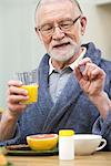 An elderly man having his medicine, Sweden.