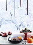 Chocolate, tangerine, and desserts in a window, Sweden.