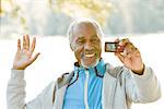 Senior man taking pictures, Sweden.