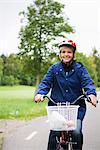 Female cyclist in a park, Stockholm, Sweden.