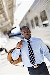 Businessman carrying a bag at a train station, Stockholm, Sweden.