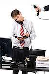 A teenage boy as a businessman at the office.