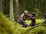 Father and son in the forest, Sweden.