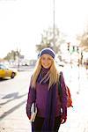 A woman walking in street in autumn, Stockholm, Sweden.