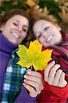 Mother, daughter and autumn leaves, Sweden.