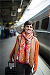 A woman at a railway station, Sweden.