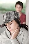 Girl and Boy Leaning on Wall