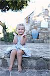 Little Girl Sitting on Steps