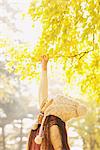 Girl Touching Leaves