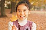 Préados Girl Holding Maple Leaf