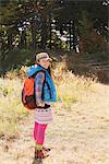 Young Woman Hiker Standing Surrounded By Nature