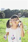 Girl Blowing Bubbles