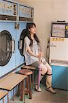 Young adult woman in Laundrette