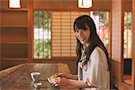 Young adult woman in Japanese style café